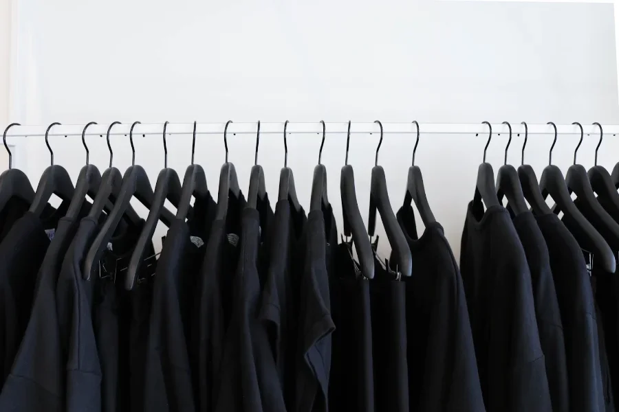 Men’s black fashion t-shirts on a rail