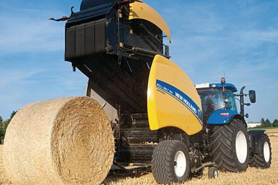 mini roll round hay baler with a tractor