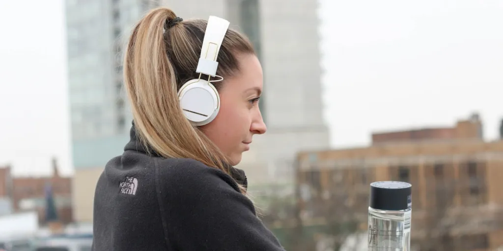 person wearing white over ear headphones