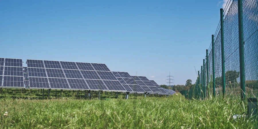 solar power plant on green grass field