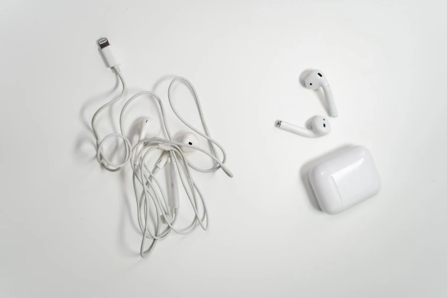 wired and wireless earbuds on a white background