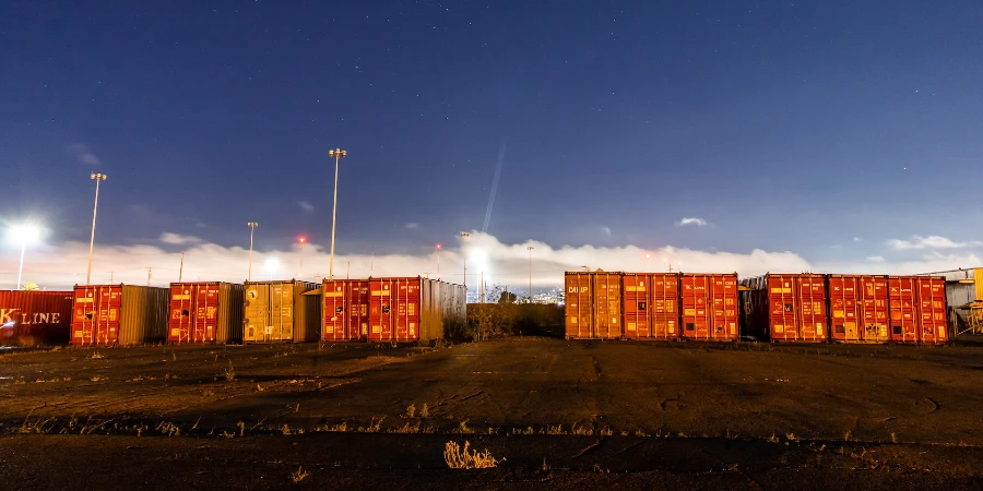 Yellow and red cargo containers during night time