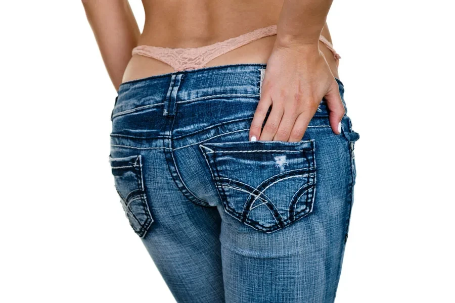 Woman in low-rise jeans with a whale tail