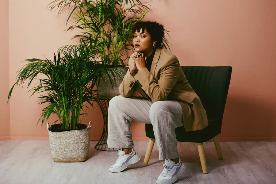Woman posing in eye-catching luxe tailoring