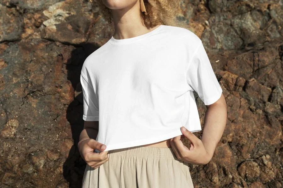 Woman showing off a cropped boxy tee