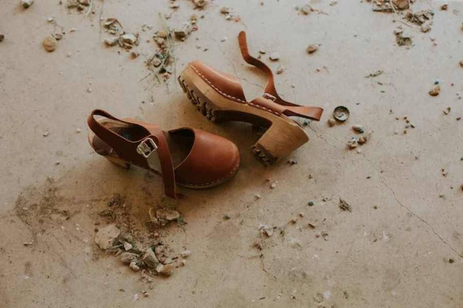 A pair of brown sandals with lug soles