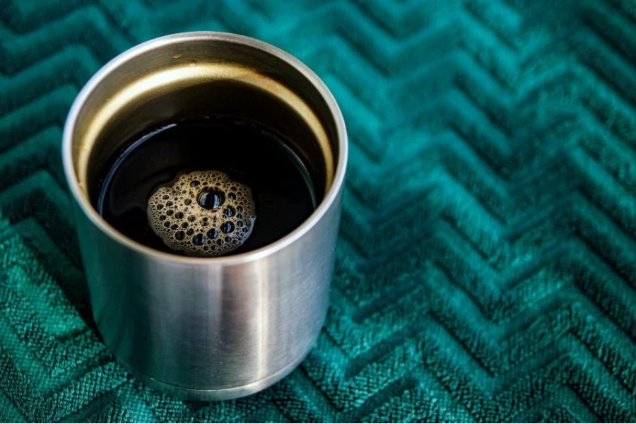 Black coffee in a stainless steel cup