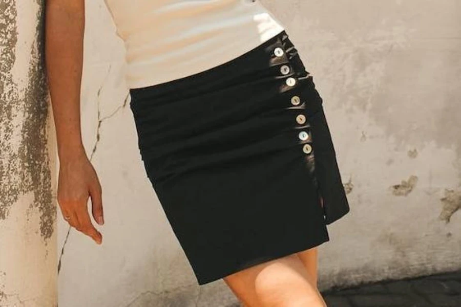 Black skirt with diagonal button row at the side