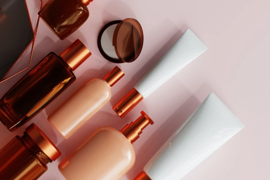 Bottles of beauty products on a light pink background