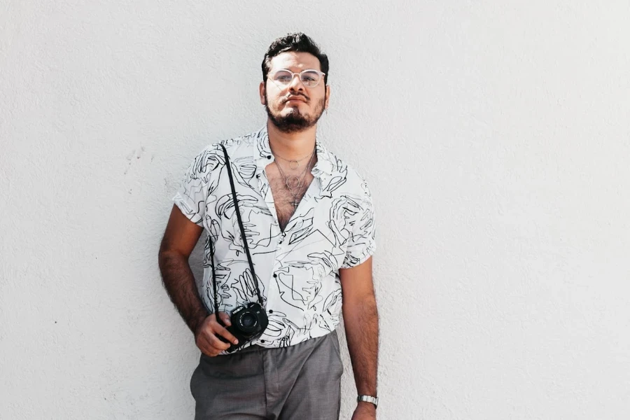 Cameraman pulling off a printed shirt outfit