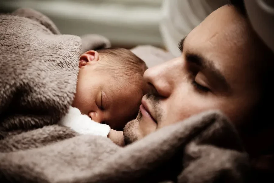 Closeup of dad and his child sleeping