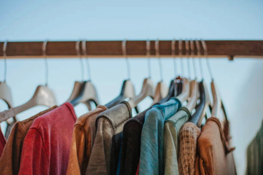 Different types of clothing tops on hangers
