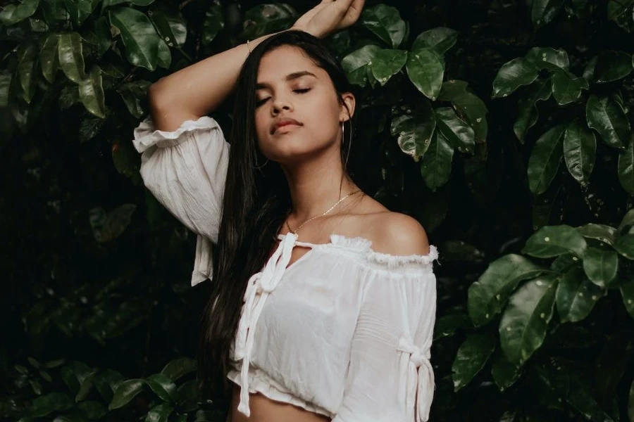 Girl wearing a white off-shoulder crop top