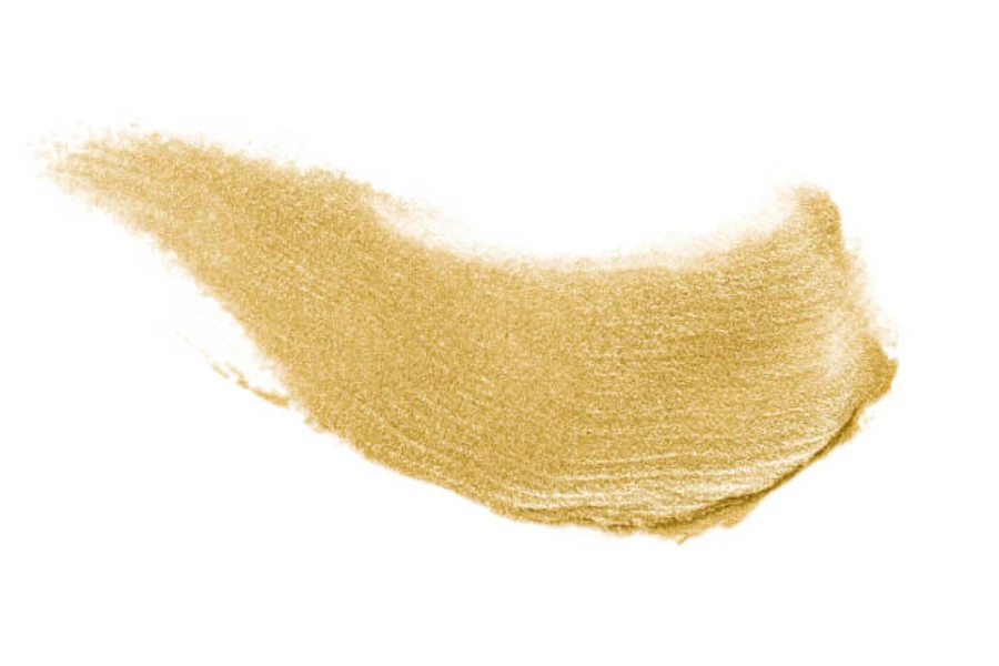 Gold colored lipstick swatch