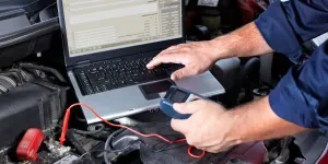 Hands of a mechanic working in an auto repair shop