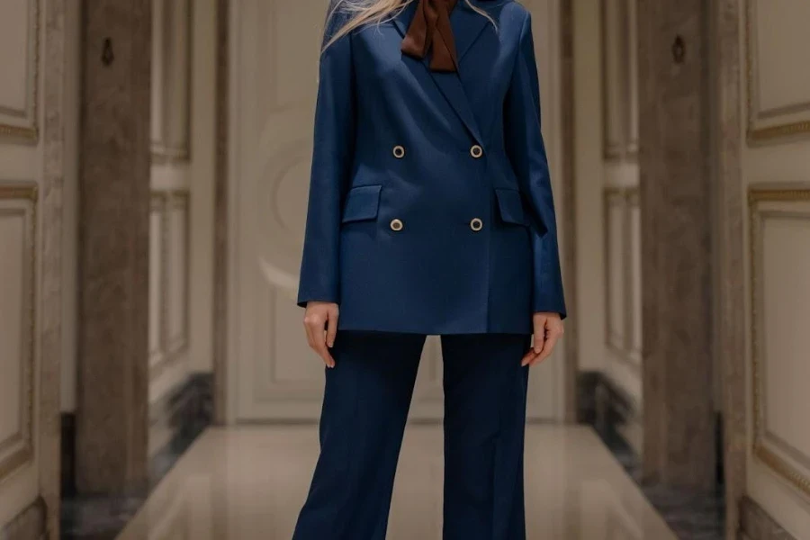 Lady posing in a blue wide-leg suit