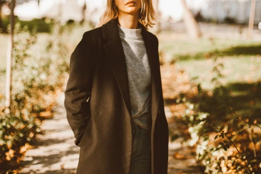 Lady posing in a brown oversized coat