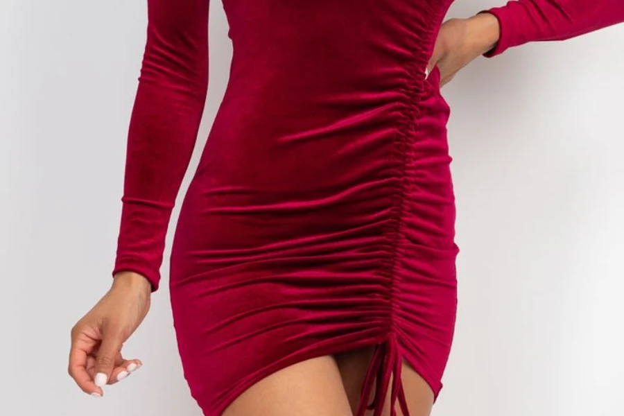 Lady rocking a red mini dress with side drawstrings