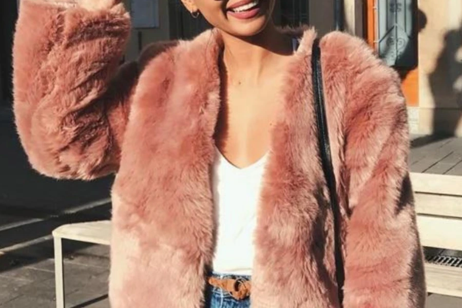 Lady wearing a pink faux fur coat