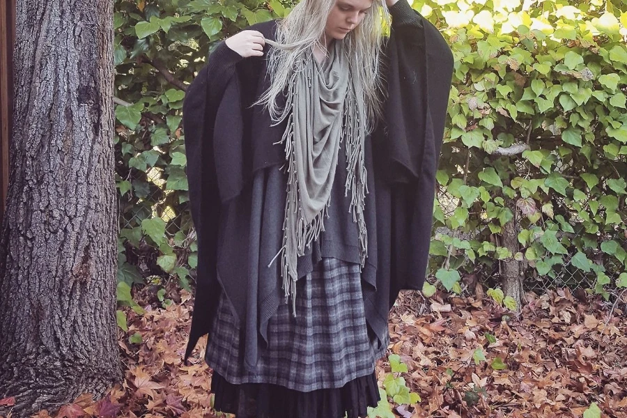 Light-haired lady in a witchy attire