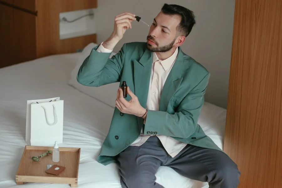 Man applying a serum to his face