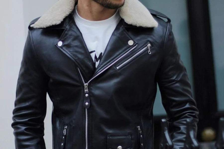 Man in a military-inspired black leather jacket