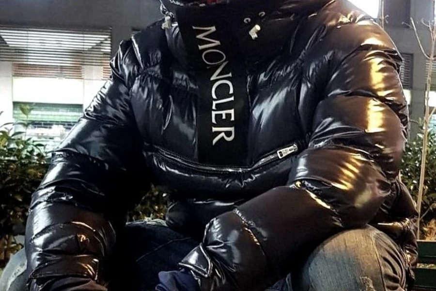 man posing in a pvc puffer jacket