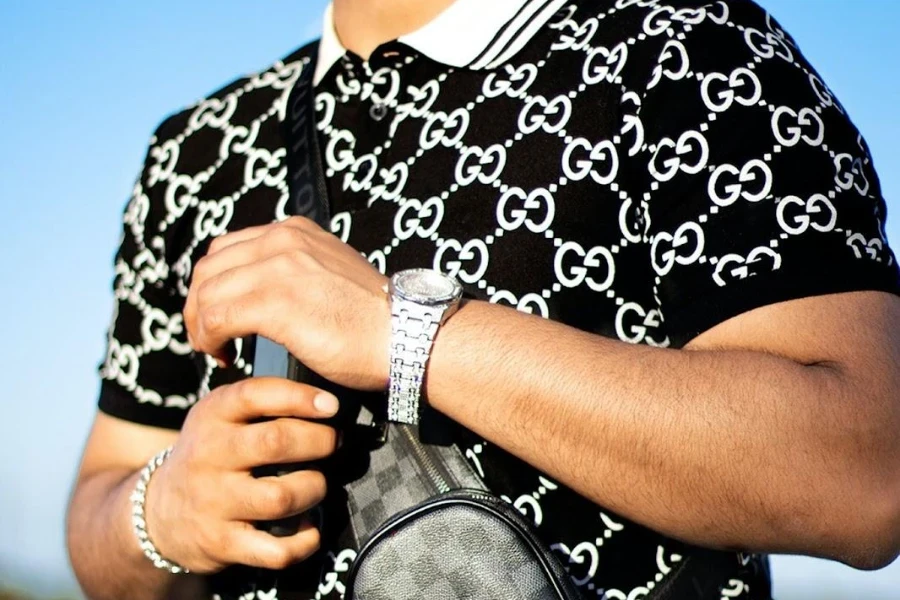 Man wearing a black and white monogram polo