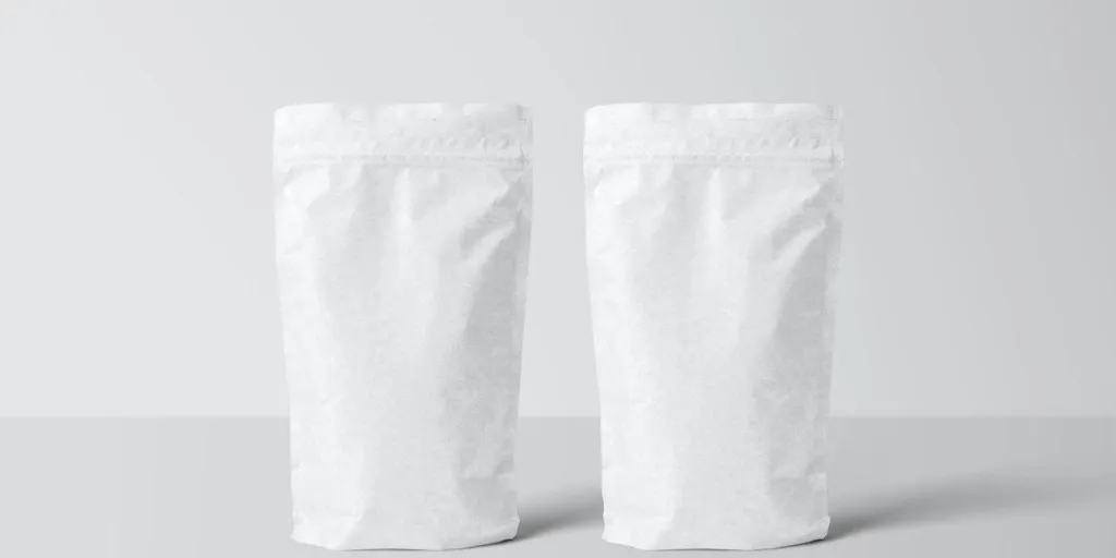 Two white stand-up pouches on a white background