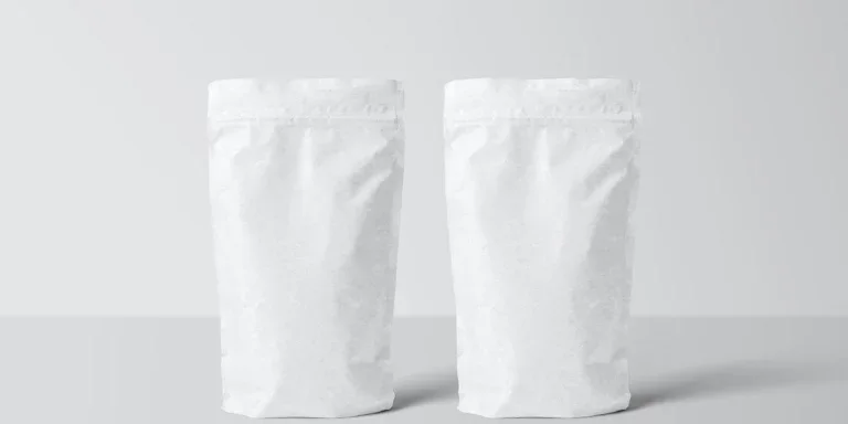Two white stand-up pouches on a white background