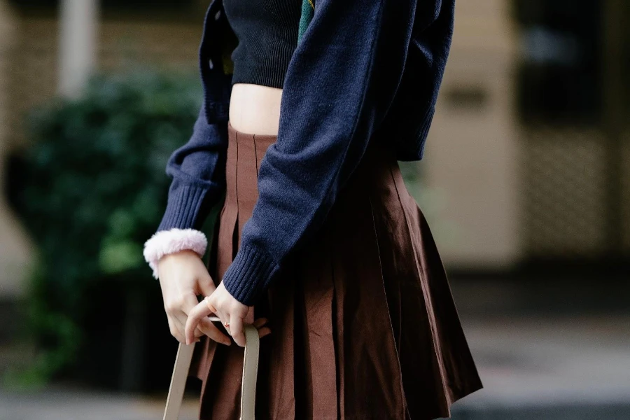Woman dressed in a brown tennis skirt