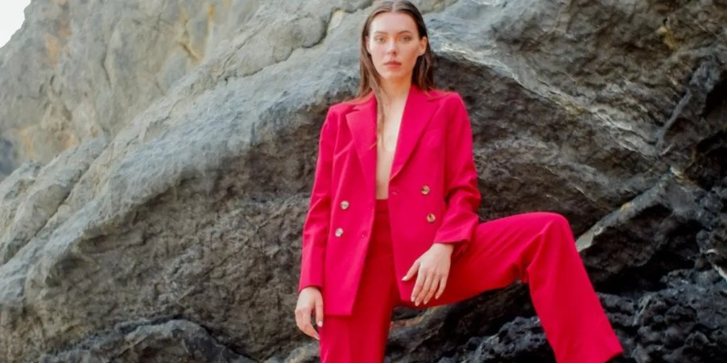 Woman posing in a bright red suit