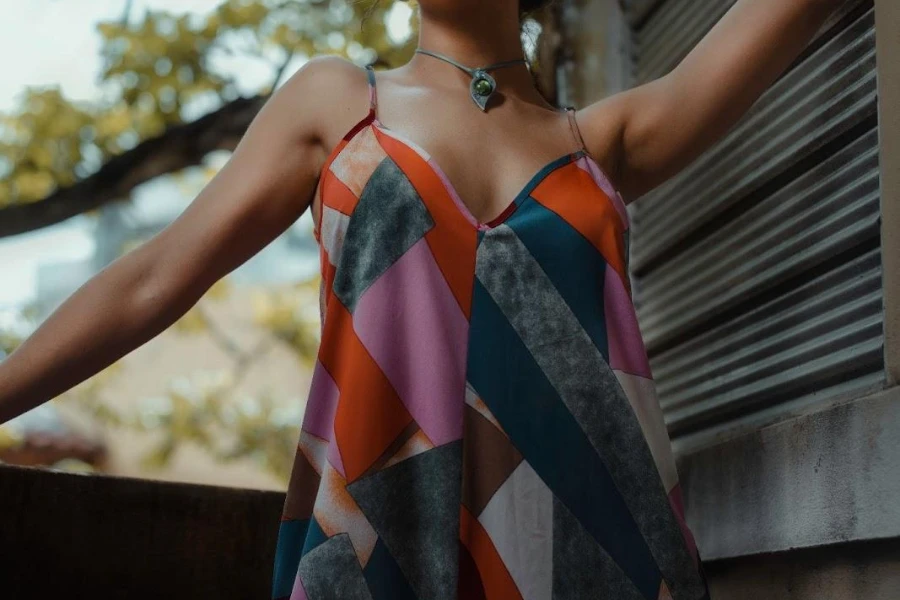 Woman posing in a geometric-patterned dress