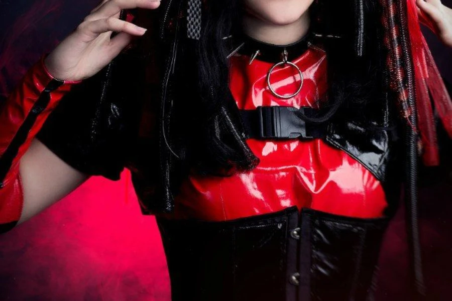 Woman posing in reflective red cybergoth festival attire