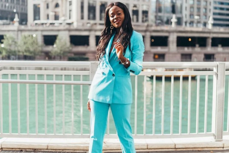 Woman posing stylishly in a dapper blue suit