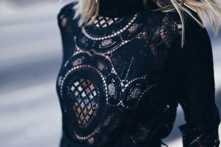 Woman rocking a sheer lace blouse