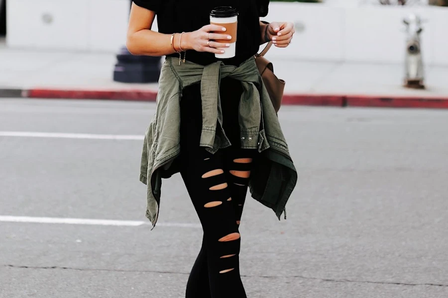 Woman walking on the streets in distressed leggings