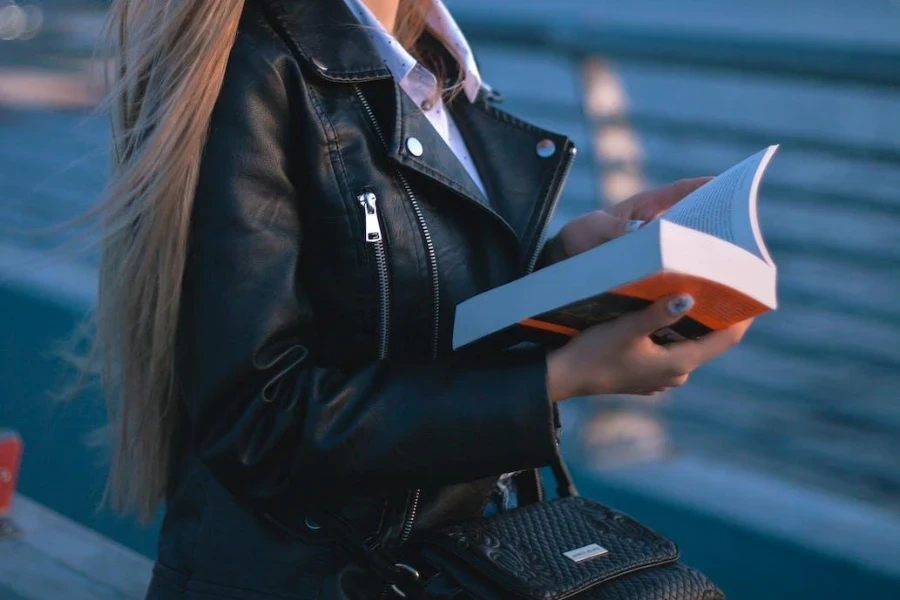 Woman wearing a tailored, black, leather jacket