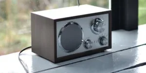 A boxy radio sitting near a window