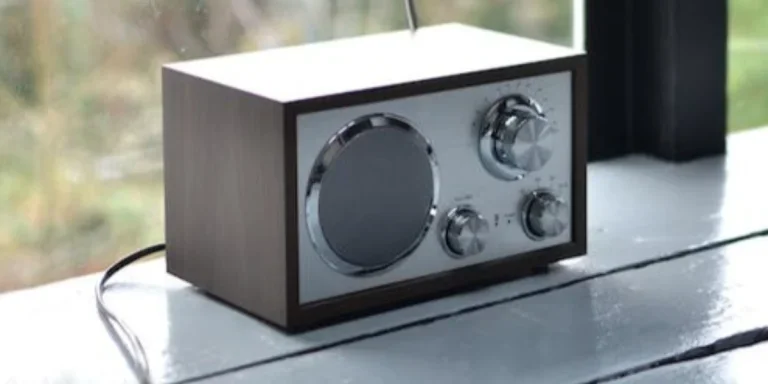 A boxy radio sitting near a window