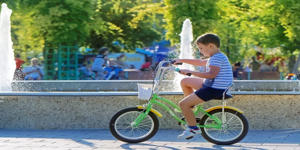 A boy riding two-wheeled bicycle