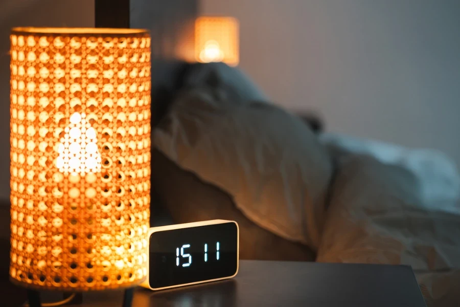 a modern alarm clock on a dark table