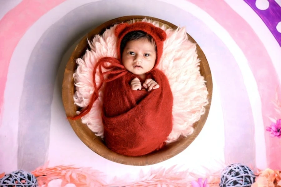 a newborn baby wrapped for a photoshoot