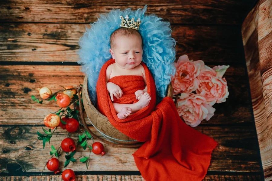 a newborn wrapped in a swaddle