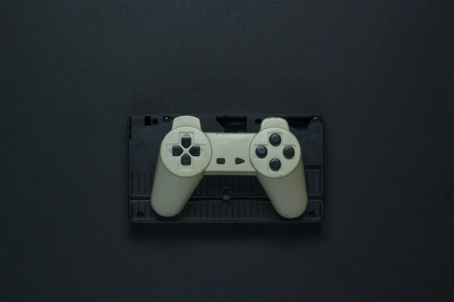 a retro game controller on a black background