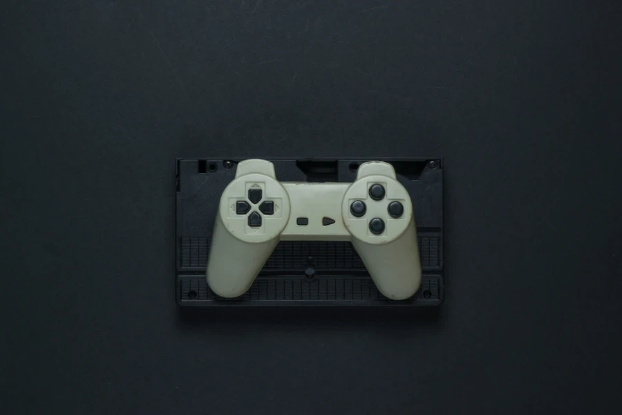 a retro game controller on a black background