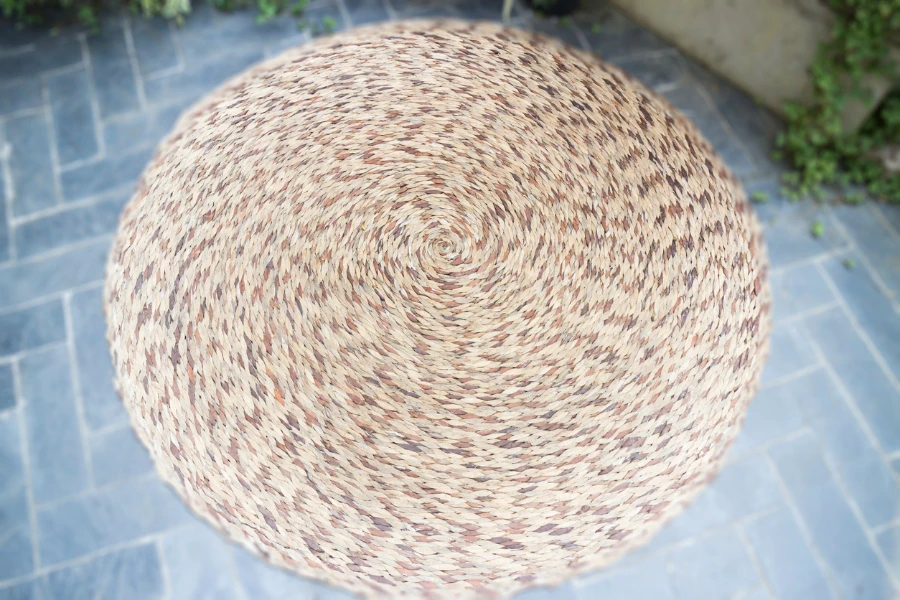 A woven rug in an outdoor garden