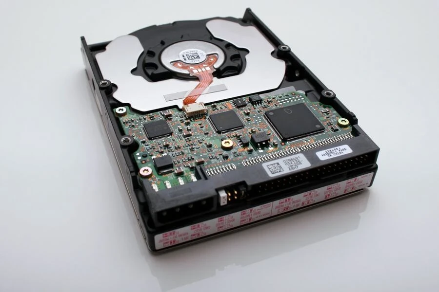 an internal hard drive on a gray surface