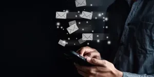 businessman sending email by smartphone to receiver