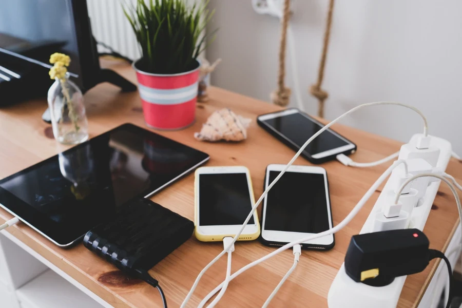 charged mobile phones and tablets on a desk